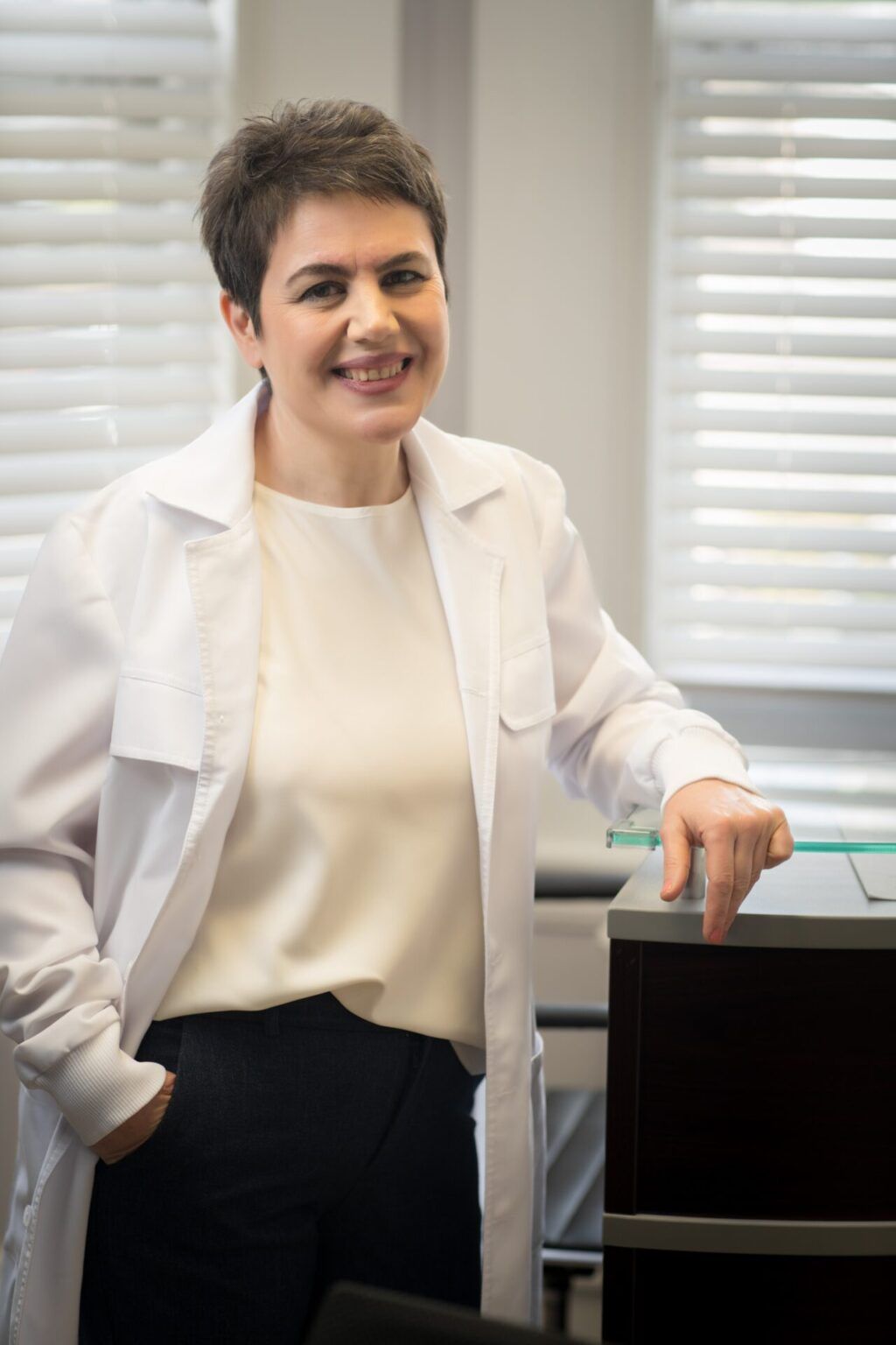 Portrait of Dr. Evis Myftiu, dentist at Excellence Dental Care