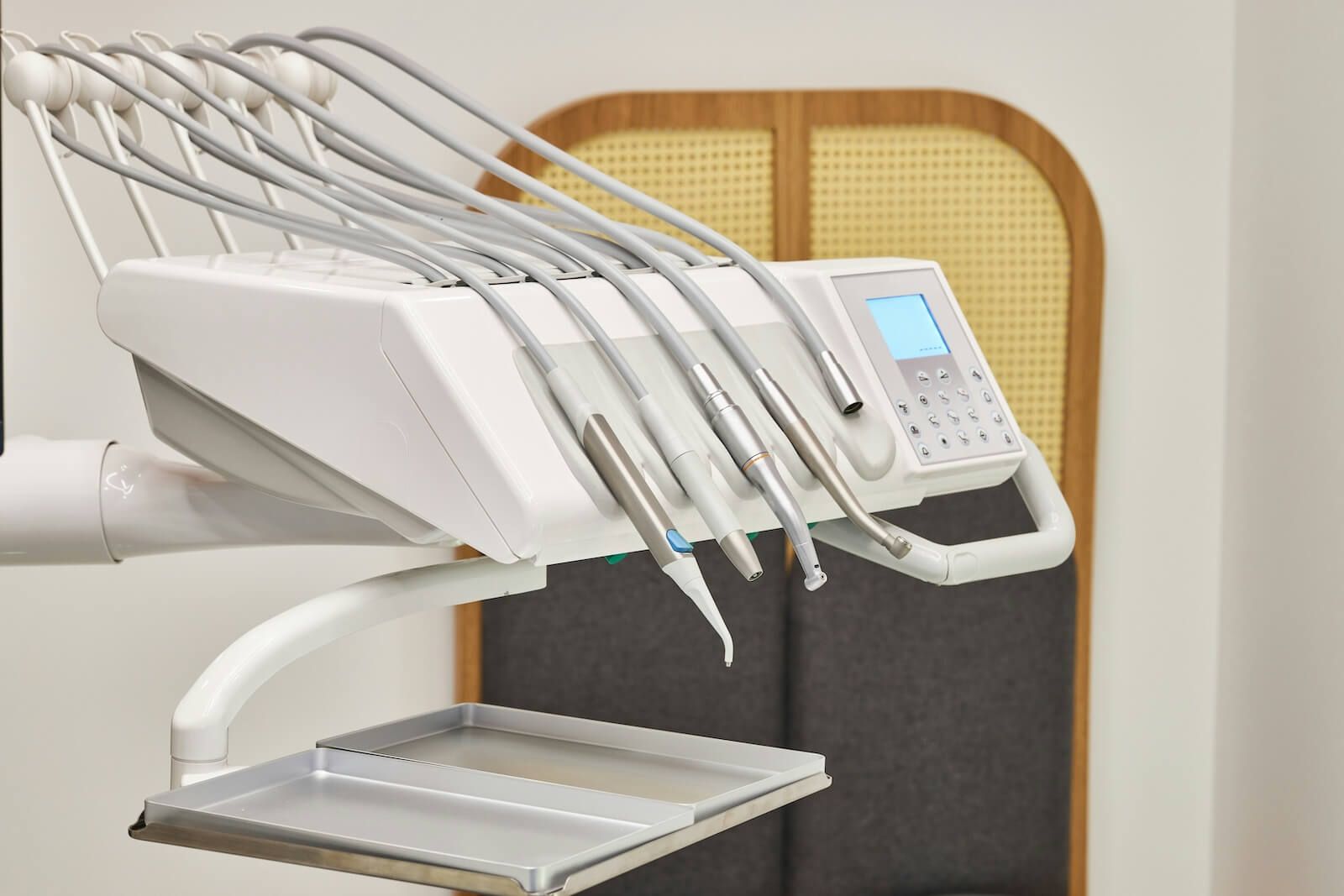 Electric dental handpieces arranged on a treatment unit