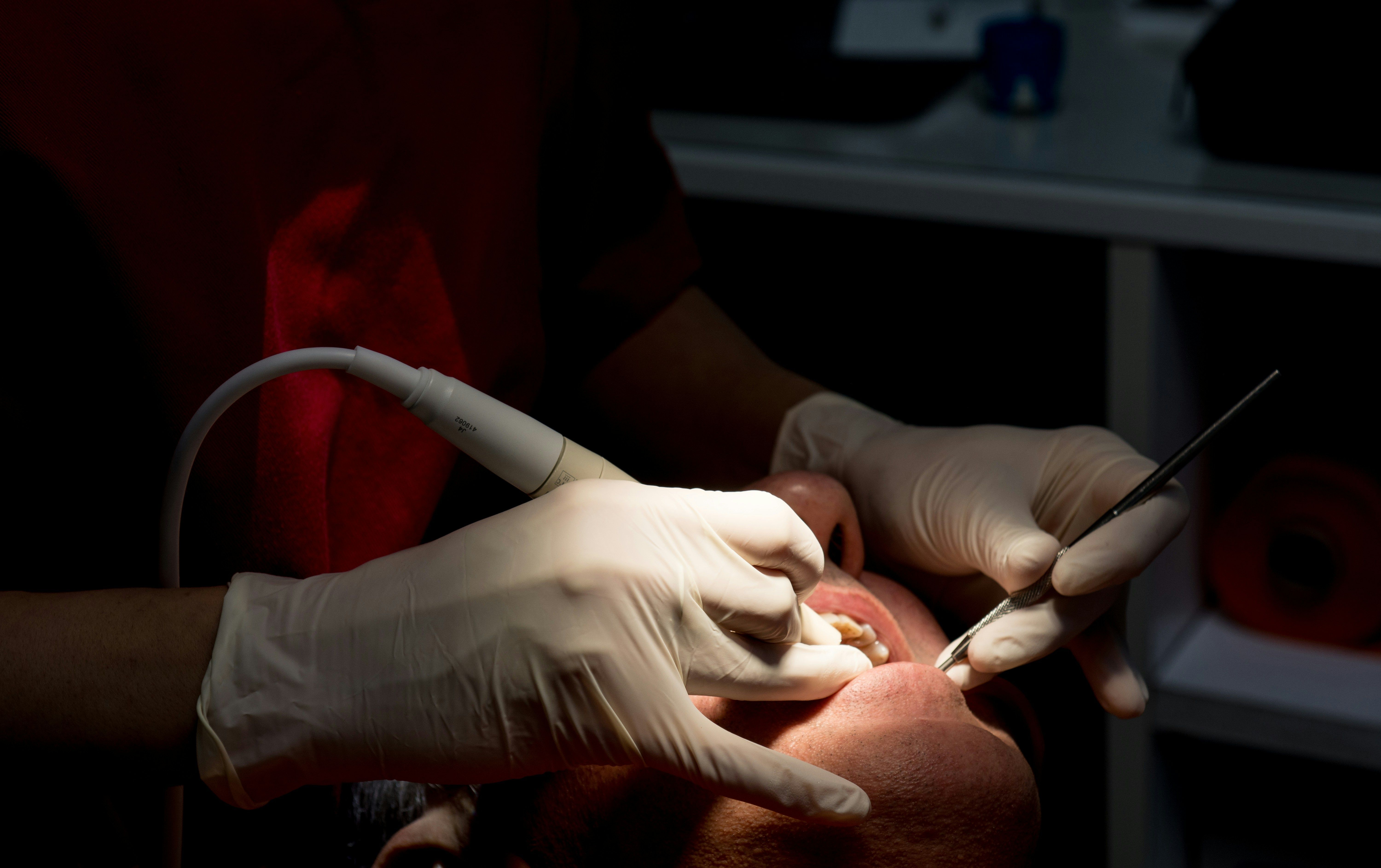 A dentist examining a patient during a dental visit